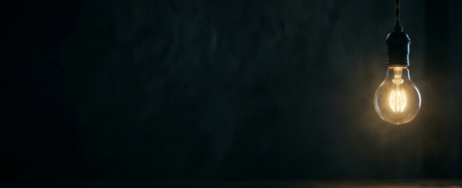 A lightbulb on a dark background.
